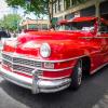 A vintage bright red chevy is on display during the 2014 Greenwood Car Show a popular family activity in Seattle for kids and dads who like cars