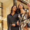 Two women standing outside a fancy clothing store. Photo courtesy of The Bellevue Collection
