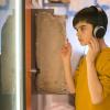 Seattle sensory-friendly activities, a boy wears headphones and looks at an exhibit