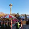 Seattle Christmas Market is it good for kids carousel with Space Needle and vendor village behind