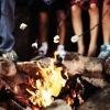 Roasting marshmallows at an classic overnight summer camp