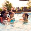 a family in a pool using a seattle hotel pass as a way to access this amenity