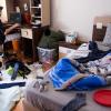 Teenage boy in a messy bedroom