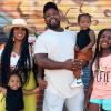 Local Instagram Influencer Latasha Hayes stands for a portrait with her family in Tacoma, WA