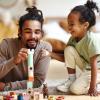 dad playing on the floor with his child