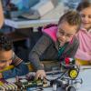 kids working on a robotics project at a mid-winter camp