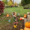 young girl popping bubbles at a fall festival at Stocker Farms, a festive seasonal activity for Seattle-area families