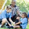 girl playing soccer who has hurt her ankle
