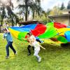kids playing with a parachute at recess