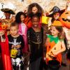 Group of kids in Halloween costumes 