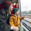 mom and child traveling on a train