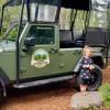 Keeper Adventure jeep with a little girl standing next to it
