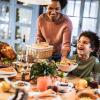 happy family at Thanksgiving table