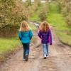 Two girls out for a walk on their own enjoying unsupervised play