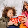 mom and son drinking hot chocolate together