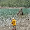 boy playing at the edge of the cedar river