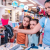 mother and daughters shopping in a store