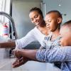 Family washing their hands together