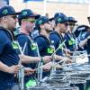 drumline wearing Seattle Seahawks football jerseys in a parade