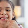little girl with lost tooth