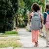 two girls walking to school together