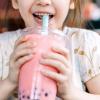 little girl drinking boba bubble tea