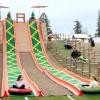 kids going down the mega slide during Baby Animals and Blooms Days at Maris Farms