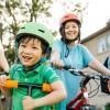 family biking outside in summers