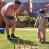 grandpa and girl playing yard games on Father's Day