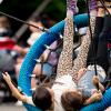 kids swinging on the Artists at Play Playground in Seattle Center, a fun weekend activity for Seattle families