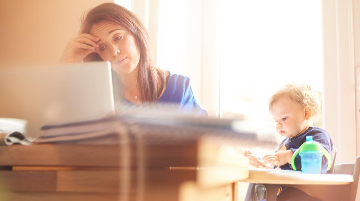 Young mother with computer and child