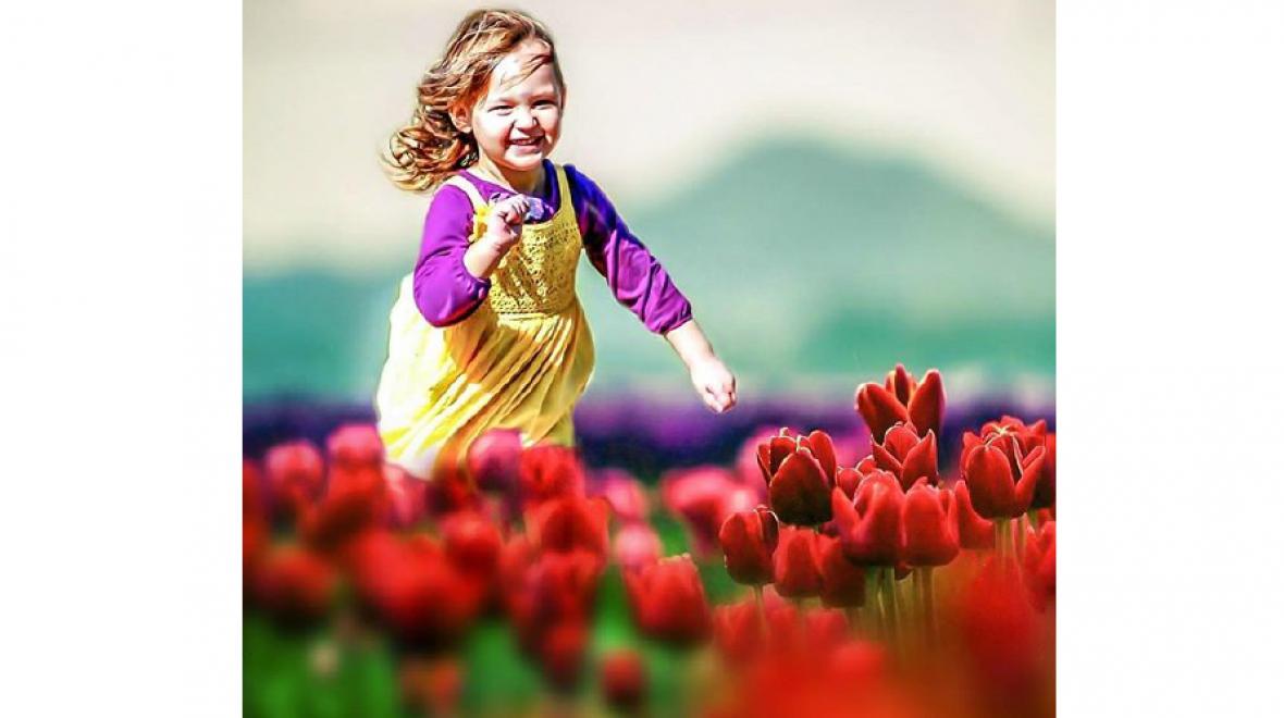 Girl Running in Tulips