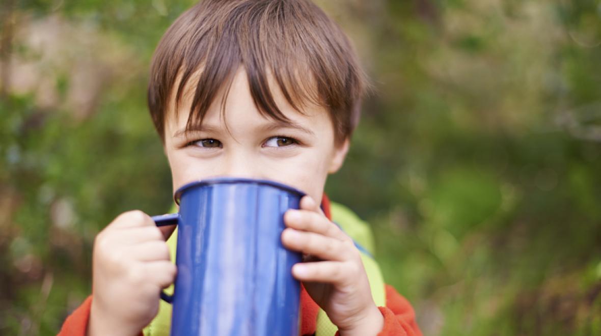 boy with camping cup