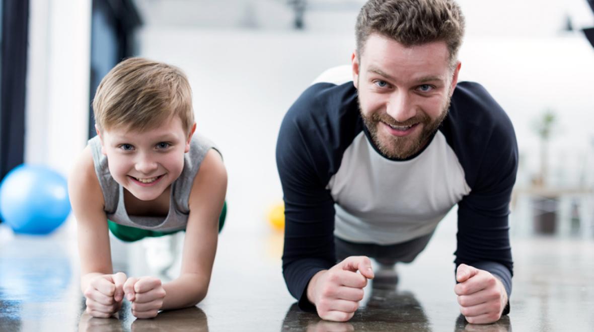 Dad and child exercising
