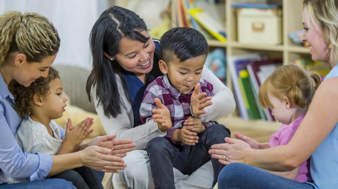 Moms and children playing