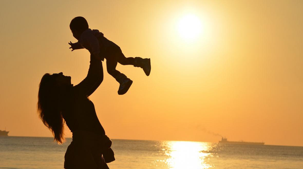 mother and child at sunset