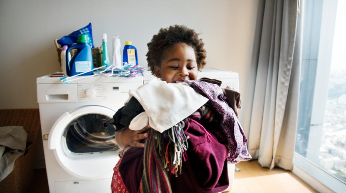Child doing laundry