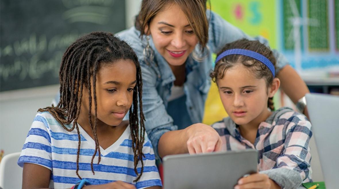 Middle school teacher with two female students