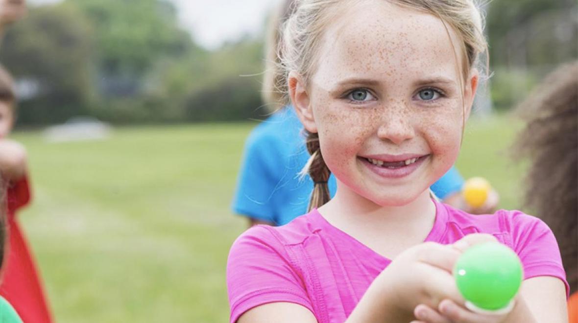Girl doing an egg and spoon race