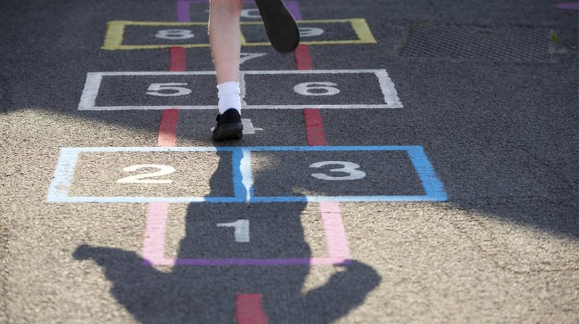 Child playing hopscotch