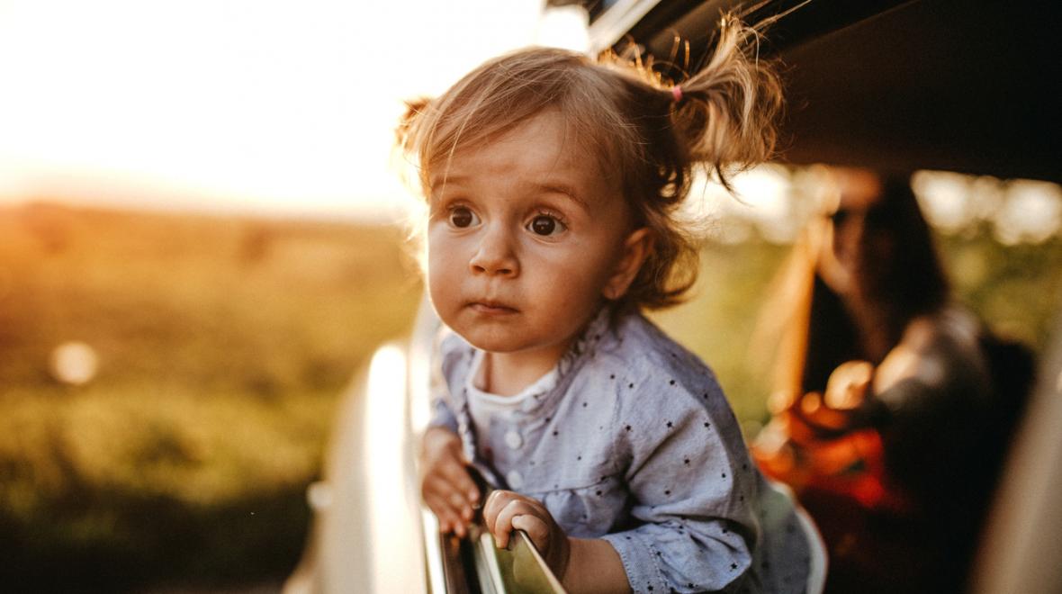 Kid looking out car window