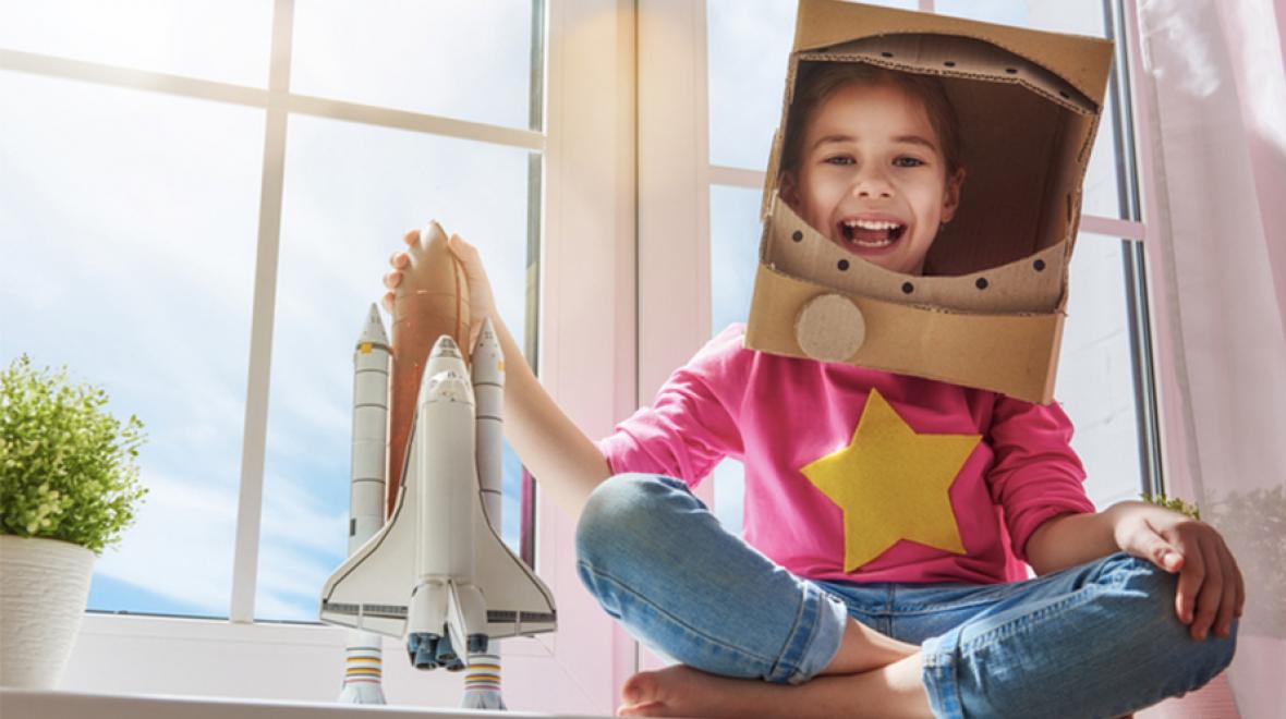 Girl with toy rocket