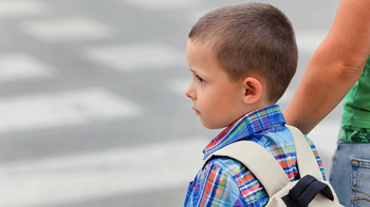 Young boy going to school