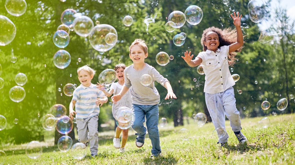 kids playing outside with bubbles