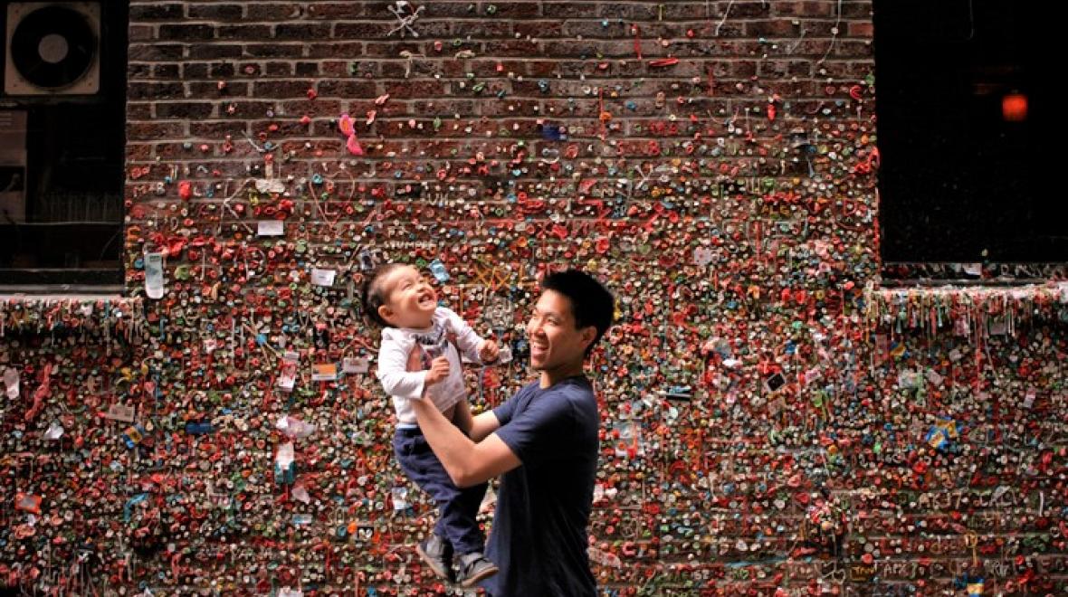 Family photo shoot at Seattle's Pike Place Market gum wall