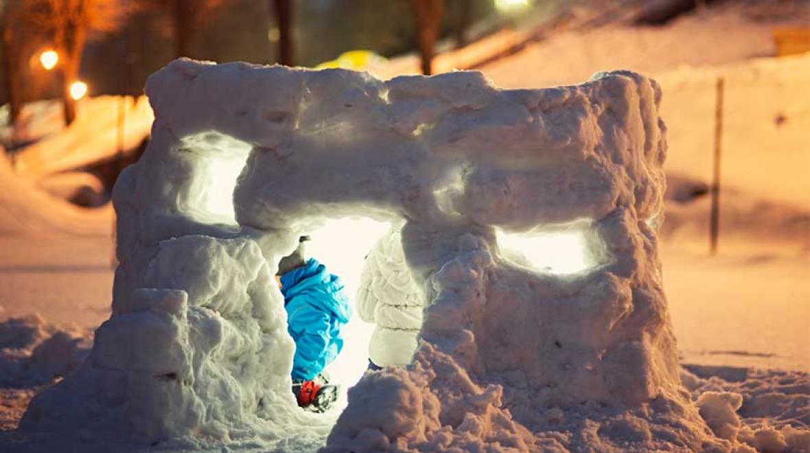 kid building an ice shelter