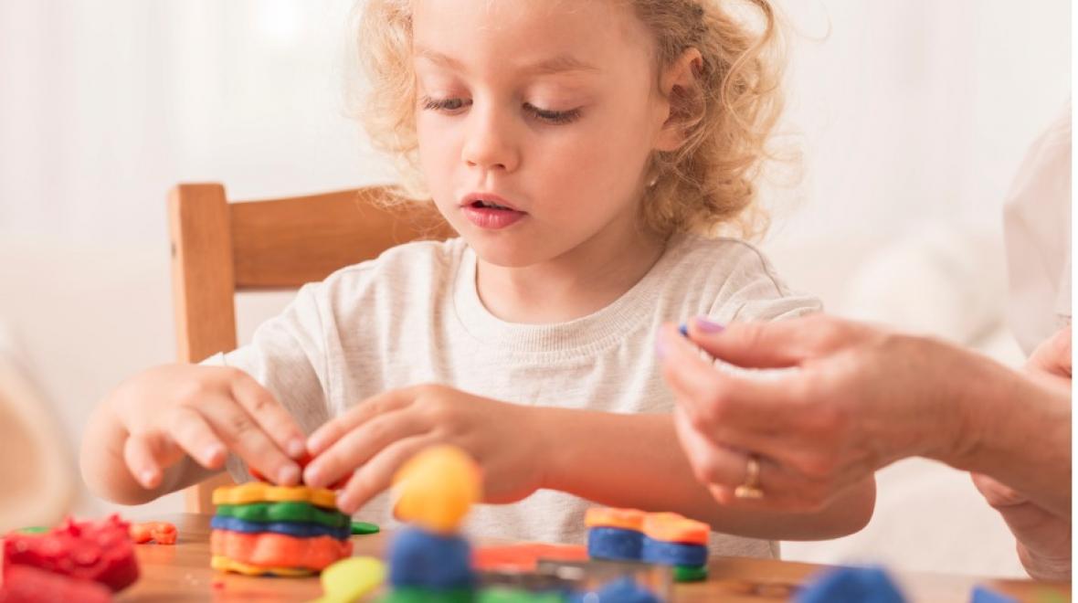 kid playing with play-dough