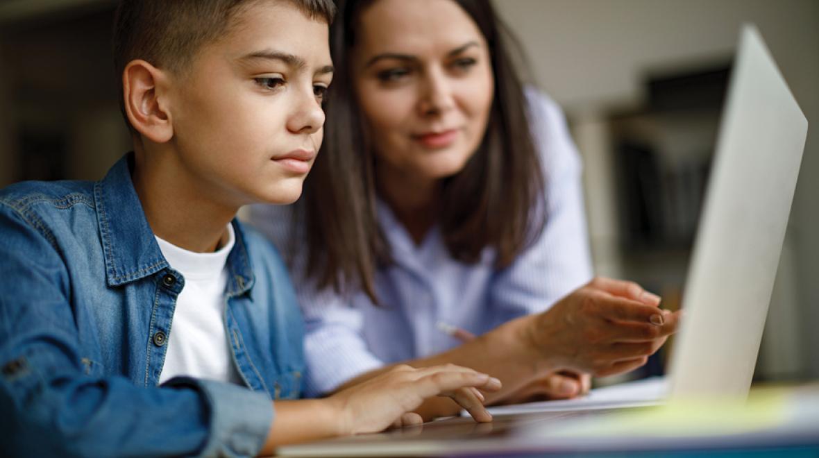 boy with mom on computer