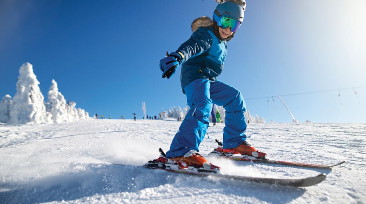 girl skiing on a sunny day