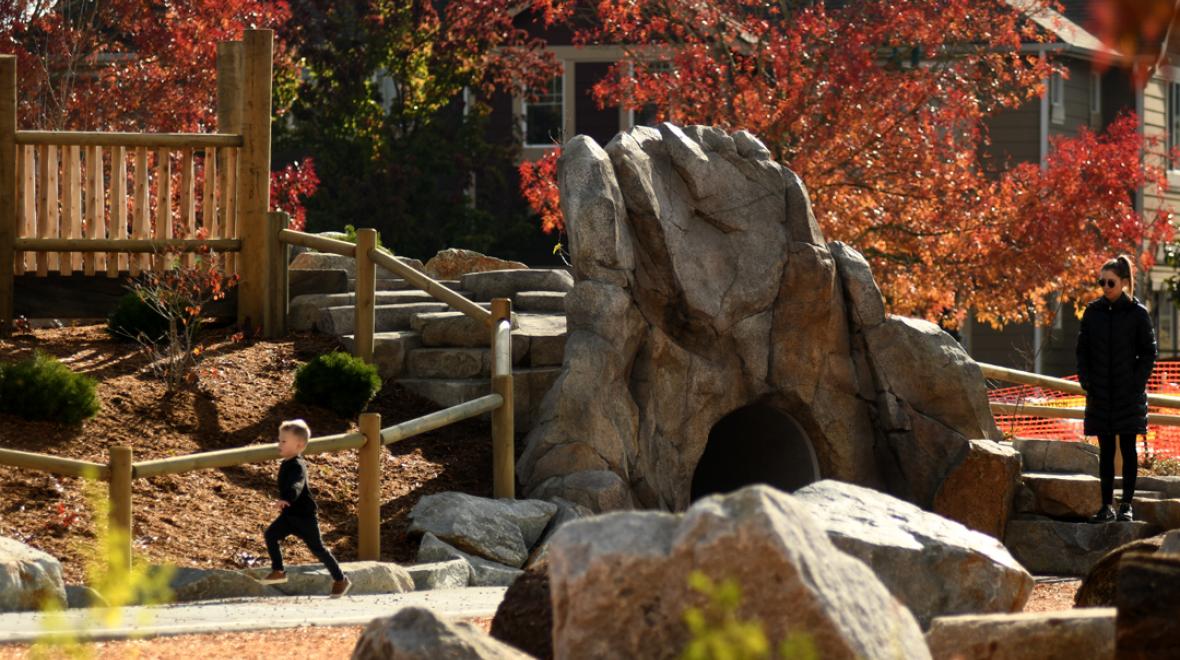 Kids-playing-rock-tunnel-Exploration-Park-Mill-Creek-best-new-playgrounds-seattle-area-families